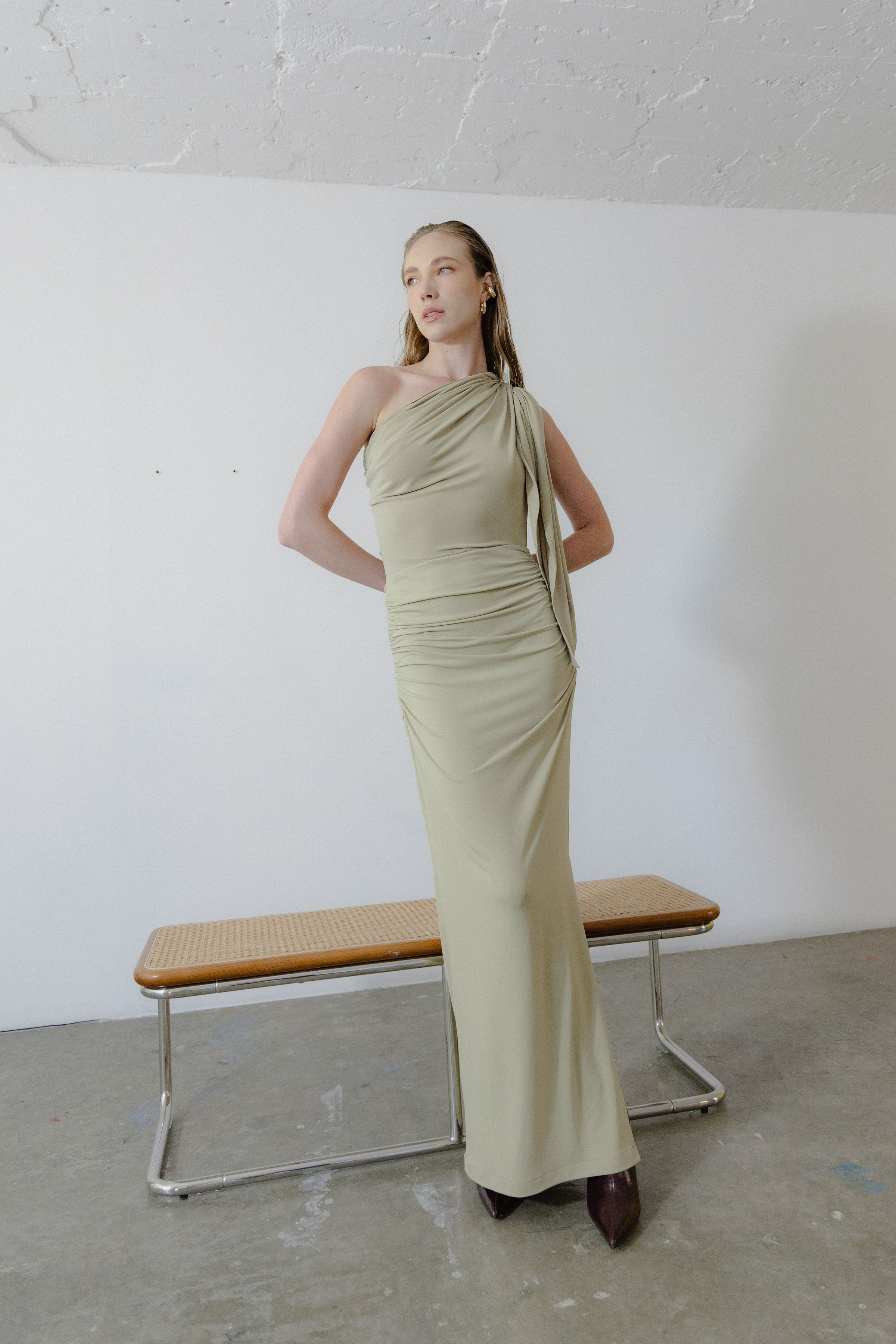 Dress worn in one-shoulder style paired with statement earrings