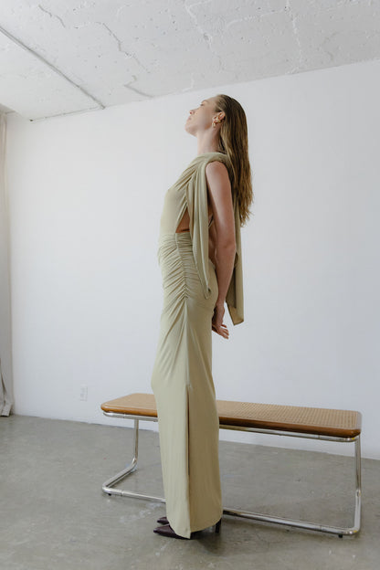 Side view of ankle-length draped jersey dress