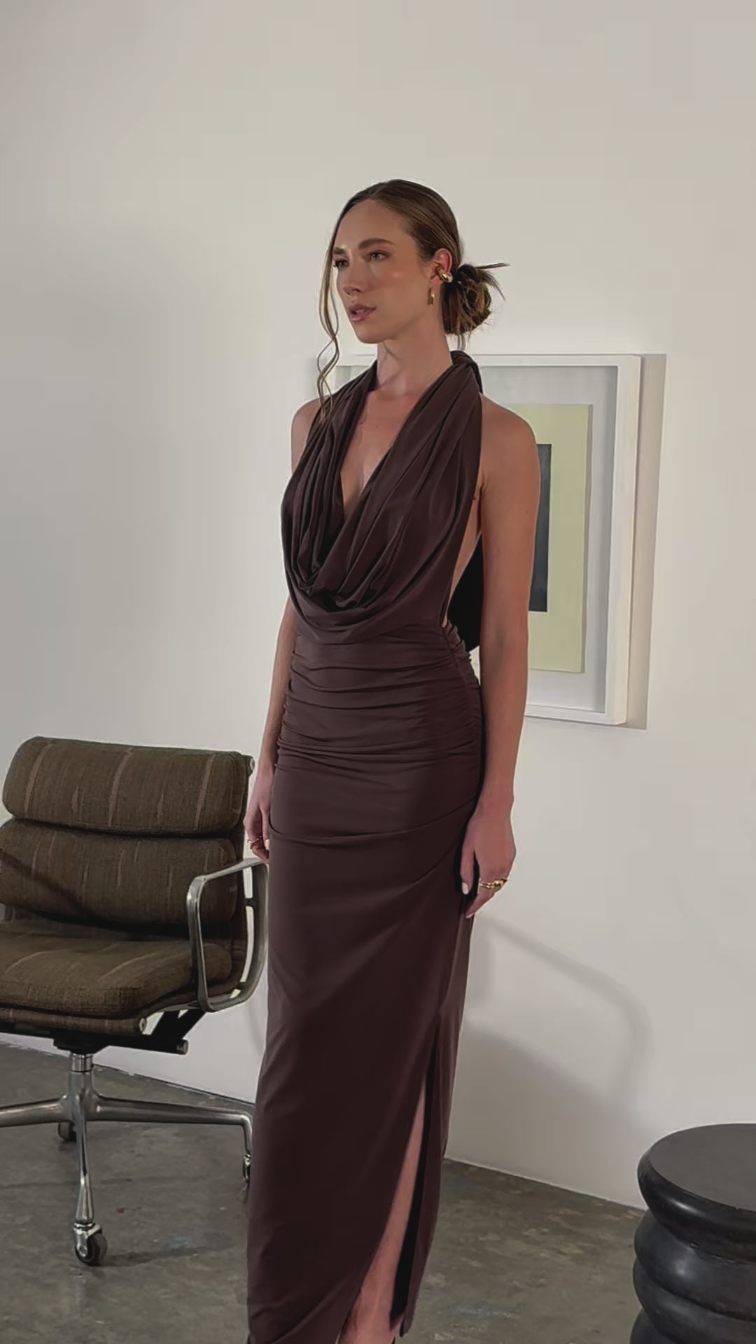 Woman wearing multiway Gina Dress in halter style on neutral background